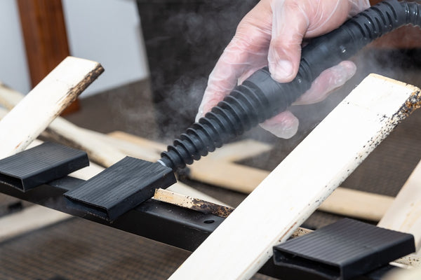 Bed Bug Steamer treating bed frame