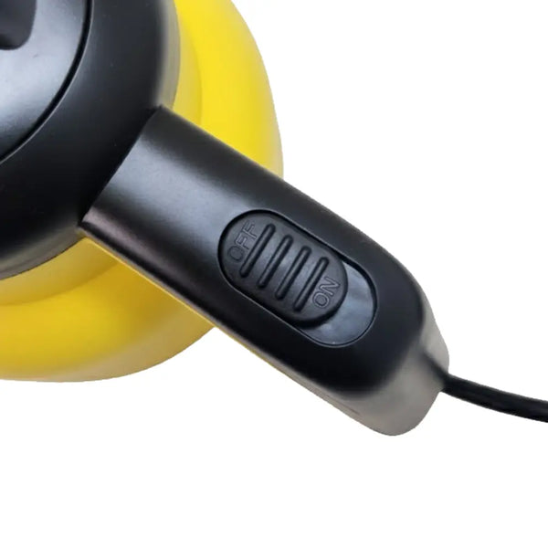 Close-up of a yellow and black steamer on a white background